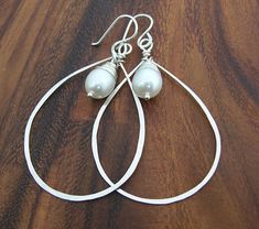 Pearl Hammered Teardrop Hoop Earrings Sterling Silver Teardrop Bridal Earrings, Handmade Teardrop Pearl White Earrings, Elegant Handmade Teardrop Pearl Earrings, White Teardrop Earrings For Anniversary, Teardrop Pearl Charm Earrings For Anniversary, Handmade Elegant Teardrop Crown Earrings, White Teardrop Wire Wrapped Earrings, Elegant Handmade Teardrop Earrings, Handmade Teardrop Bridal Earrings For Anniversary