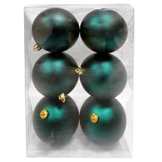 four green christmas balls in a clear box with gold trimmings on each ornament