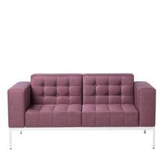 a purple couch sitting on top of a white table