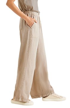 Capture that vibe wherever you are with these breezy lyocell and linen palazzo pants finished with a comfy elastic waist and handy pockets. 29" inseam; 29" leg opening; 11 3/4" front rise; 16 1/2" back rise (size Medium) Elastic waist 70% lyocell, 30% linen Machine wash, tumble dry Imported Versatile Full Length Wide Leg Pants For Vacation, Relaxed Fit Wide Leg Pants For Vacation, Baggy Wide Leg Vacation Pants, Versatile Wide Leg Beach Pants, Versatile Wide Leg Pants For Beach, Vacation Wide Leg Pants With Pockets, Vacation Linen Full-length Bottoms, Linen Full Length Bottoms For Vacation, Flax Wide Leg Pants For Loungewear