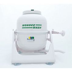 the wonder wash machine is white and has green lettering on it's front end