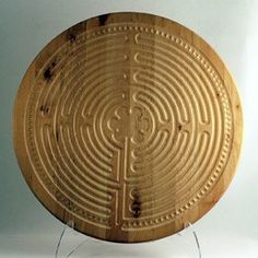 a wooden plate with an intricate design on it