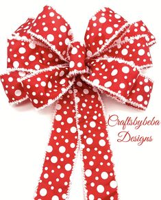 a red and white bow with polka dots on it