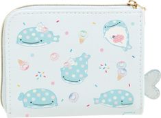 a white purse with blue whale and ice creams on the front, along with polka dots