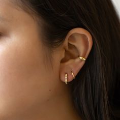 Classic Gold conch ear cuff that will hug your conch perfectly. Perfect to wear alone or paired with other huggie earrings. Sold as a single earring. Gold Vermeil Hypoallergenic, lead and nickel free Thickness 3mm Inner Diameter 0.35in(9mm) #J522-G Trendy Huggie Ear Cuff For Everyday Wear, Dainty Huggie Ear Climbers For Pierced Ears, Trendy Huggie Ear Cuff For Pierced Ears, Modern Everyday Huggie Piercings, Dainty Adjustable Small Hoop Ear Cuff, Everyday Pierced Huggie Ear Climbers, Tarnish Resistant Huggie Ear Cuff, Adjustable Huggie Wrap Earrings For Pierced Ears, Everyday Huggie Ear Climbers