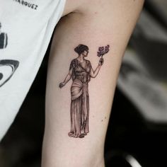 a woman with a flower in her hand tattoo on the left arm and right arm