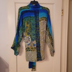 Ravishing 100% Indian Silk Tie Top In Shades Of Peacock, Green, And Beige. Never Worn, One Size To Probably A 16. Can Be Tied To Adjust Fit Or Left Open As Shown. Versatile Layering Piece. Just Beautiful. Blue Long Sleeve Silk Top, Blue Silk Long Sleeve Top, Blue Silk Long Sleeve Blouse, Bohemian Blue Silk Tops, Blue Silk Top For Spring, Spring Blue Silk Top, Sea Side, Peacock Green, Tie Top