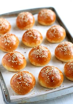 the buns are ready to be baked in the oven and served on a baking sheet