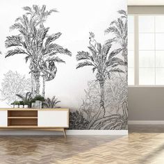 the wallpaper in this room is painted with black and white palm trees