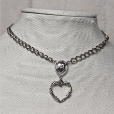 Rosary Style Barbed Wire Heart And Heart Charm Choker Necklace. Hanging Heart Charm Measures Approximately 24x24mm. Comes On A 14 Inch Chain Necklace Necklace With A Lobster Clasp And 1.5 Inch Extension Chain Valentine's Day Silver Metal Heart Necklace, Valentine's Day Silver Heart Necklace, Silver Metal Heart Pendant Necklace, Silver Metal Heart Choker Necklace, Silver Double Heart Metal Necklace, Silver Double Heart Chain Necklace, Silver Open Heart Metal Necklace, Gothic Heart Necklace With Heart Pendant, Gothic Heart Necklace With Heart Charm