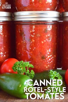 tomatoes, peppers and other vegetables sit in front of jars filled with canned rote - style tomato sauce