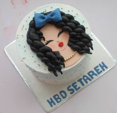 a birthday cake with a woman's face on it