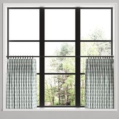 an open window with curtains and trees in the background