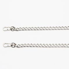 Chain purse strap. Turn your clutch purse into a versatile hands-free bag with this silver purse chain. 40 inch long silver purse chain with clasps. Easily clips onto various Escama bags: Chica Rosa , Jamie, Leda, Concho and even the Coin Purse An easy way to elevate your look from casual to formal. Material: plated steel chain. Dimensions: 40" long x 1/8th" wide Hands Free Bag, Silver Purse, Chain Purse, Purse Strap, Curb Chain, Steel Chain, Free Bag, Stainless Steel Chain, Clutch Purse