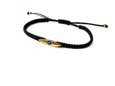 Handmade braided bracelet cord with Eye charm. Bracelet for men. Materials: 🔹 24k gold plated charm/ Enamel eye 🔹 Waterproof String 🔹 Finished with a sliding knot closure, adjustable size bracelet All items are handmade with love just for you! 🔹 Check out our shop for more jewellery https://www.etsy.com/shop/JustSeedBeads?ref=seller-platform-mcnav§ion_id=23857241 Thank you! Bracelet Cord, Sliding Knot Closure, Bracelet Evil Eye, Braided Bracelet, Sliding Knot, Gold Gift, Bracelet For Men, Braided Bracelets, Bracelet Gold