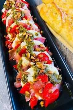 Mozzarella salad topped with pesto and roasted red pepper Mozzarella Prosciutto Appetizer Recipes, Cookout Salads, Pesto Appetizers, Mozzarella Prosciutto, Anniversary Food, Pesto Mozzarella, Recipes For Thanksgiving