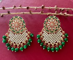 Beautiful Green Meenakari Kundan Chandbali!! Length 3 inch Width 2 inch Handcrafted pair of earrings. Gives a traditional look. Can be worn for engagement and wedding parties. Indulge in it or gift it and watch the compliments flow! It is advisable to store jewelry in a zip lock pouch (air tight pouch), keep away from water perfume and other chemicals and clean it with soft cloth. FREE SHIPPING!! Punjabi Earrings, Kundan Chandbali, Indian Jhumka, Meenakari Earrings, Pakistani Earrings, Jewelry Pakistani, Water Perfume, Earrings Indian, Store Jewelry