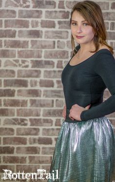 "Are you a litzy girl or a flashy flapper? Party all night long in this silver metallic skirt with a comfy 3\" black elastic waistband. Easy wear and easy care, just machine wash (cold) and tumble dry. Looks great over stockings, tights, leggings (or nothing at all!). Perfect with almost any top, casual or dressy. Goes with sandals, flats, sneakers, heels, booties or boots. Available in sizes Small, Medium, and Large; custom sizes available on request. Skirt measures 19\" long from top of waistb Silver Metallic Skirt, Flapper Party, Sneakers Heels, Bee's Knees, Nothing At All, Sandals Flats, Knee Skirts, Metallic Skirt, Photo Mask