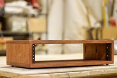 a wooden speaker sitting on top of a table