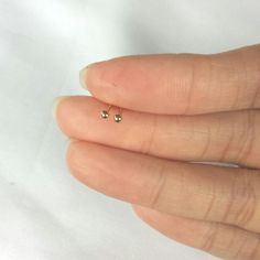 These cute studs are very tiny . They are made of 925 sterling silver ( not silver plated) then dipped in 18k gold . so they are safe for you if you have an allergy, have butterfly earnuts. The picture shows 2mm earrings. I have them available in many size 2mm, 3mm, to 6mm. Please select an size at the drop out menu The item wil be sent in a gift box. ------------------------------------------------------------------- Please read my shop policy before placing your order. 14k Gold Dainty Nickel-free Cartilage Earrings, Dainty Hypoallergenic Round Nose Studs, Dainty Gold Hypoallergenic Cartilage Earrings, Tiny Round Minimalist Nose Studs, Dainty Hypoallergenic Gold Cartilage Earrings, Dainty Yellow Gold Nickel-free Cartilage Earrings, Dainty Nickel-free Yellow Gold Cartilage Earrings, Dainty Hypoallergenic Piercings, Hypoallergenic Dainty Piercings