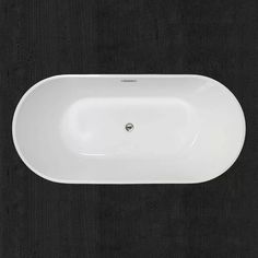 an oval shaped white sink on a black surface