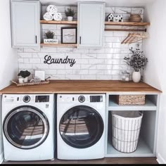 a washer and dryer in a small room with white tile backsplash