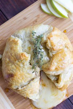 an apple pie is cut in half on a cutting board