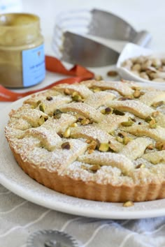 there is a pie on the table with other food items