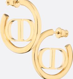 The 30 Montaigne earrings have a modern and elegant aesthetic. The finely crafted gold-finish metal ring encircles the 'CD' signature placed at the center. The earrings can be styled with other creations from the 30 Montaigne line.. Designer Gold Jewelry With Gold-tone Hardware, Classic Yellow Gold Earrings With Logo Plaque, Designer Gold-tone Logo Plaque Earrings For Formal Occasions, Luxury Gold-tone Earrings With Logo Plaque, Designer Yellow Gold Jewelry With Gold-tone Hardware, Modern Jewelry With Gold-tone Logo Plaque As Gift, Modern Gift Jewelry With Gold-tone Logo Plaque, Luxury Diamond Hoop Earrings, Designer Gold-tone Earrings For Formal Occasions