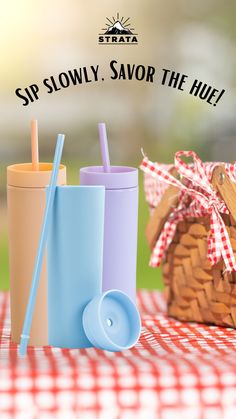 two cups with straws are sitting next to each other on a picnic table and the words sip slowly, savor the hull