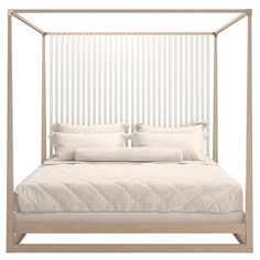 a bed with white sheets and pillows in front of a wall mounted headboard that has vertical slats on it