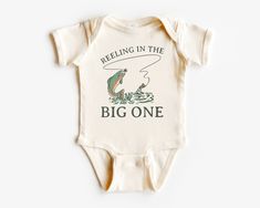 a baby bodysuit that says, feeling in the big one with a fish on it