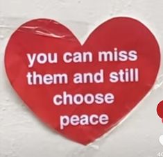 a red heart with the words you can miss them and still choose peace