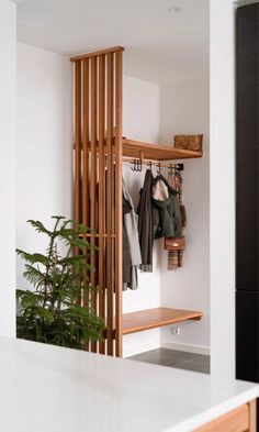 a coat rack in the corner of a room