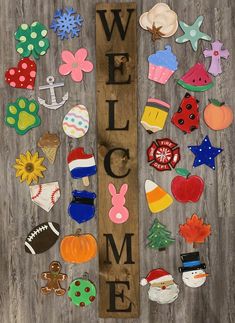 a wooden sign that says welcome with lots of magnets on it