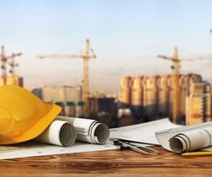 some construction equipment sitting on top of a wooden table