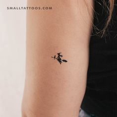 a person with a small tattoo on their arm