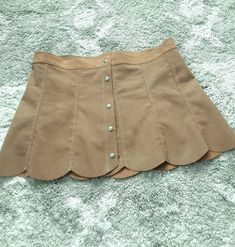 Suede skirt Retro Fitted Brown Skort, Vintage Brown Skirted Bottoms, Vintage Beige Mini Skirt, Retro Brown Flared Skirt, Retro Beige Skirt, Retro Brown Skort For Spring, Vintage Lined Mini Skirt, Retro Mini Skirt With Button Closure For Spring, Vintage Brown Skirt With Buttons