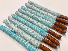 several blue and white candy sticks are lined up