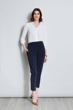 Sleek & timeless, this Slim Fit Ankle Pant is perfect for dressing up with its matching Single Button Blazer or pairing with Spring 's new knits and shirts. Featuring a slim leg & a pull on elastic back waistband, you will love the look & feel of these essential pants. T-Tahari Slim Fit Pant with Elastic Back Waistband Runs True to size Model is 5 '9 " and wearing a size S Imported Style #: THF17000A Slim Fit Ankle-length Work Pants, Classic Slim Fit Ankle-length Dress Pants, Classic Slim Fit Pants With 5-inch Inseam, Slim Fit Blue Ankle-length Dress Pants, Semi-formal Slim Fit Wool Pants, Essential Pants, Single Button Blazer, Ankle Pants, Slim Fit Pants