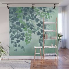 a wall mural with green leaves on it