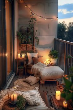 the balcony is decorated with candles and pillows