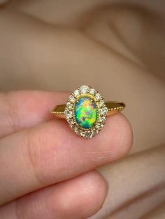 Item Information opal:              0.48cts Weight (ring)     3.60g Size (ring)      10×12mm Weight (diomand):  0.35cts The size of the ring can be adjusted Attention：All Opal stones are from Australia, and some of the finished products are designed and processed in China.So Opal products in my store are delivered by Chinese factories. More Affordable price，Only make a reasonable profit，So I can offer a high quality item and affordable price for every customers， Better service ，if you have any problem with my item，please feel free to contact me， I will try my best to solve it. Free EMS Ethiopian Opal Oval Ring For Wedding, Elegant Ethiopian Opal Ring For Anniversary, Formal Yellow Gold Ethiopian Opal Ring, Luxury Opal Rings With Gemstones, Formal Ethiopian Opal Ring Fine Jewelry, Yellow Gold Ethiopian Opal Ring For Anniversary, Yellow Gold Ethiopian Opal Anniversary Ring, Anniversary Ethiopian Opal Ring In Yellow Gold, Heirloom Multi-stone Opal Ring