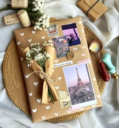 a bunch of flowers sitting on top of a brown paper with pictures attached to it