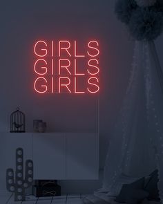 there is a neon sign that says girls girls on the wall next to a dresser