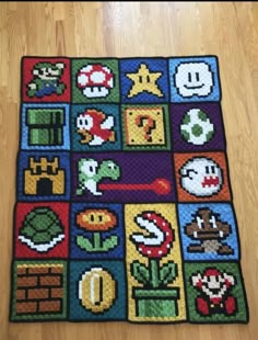 the rug is made up of different types of video game characters and symbols on it