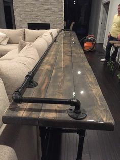 a long table sitting in the middle of a living room