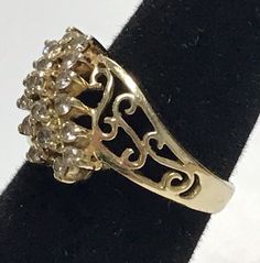 Stunning 14K Yellow Gold .95 CTW Diamond Cluster Filagree Ring Sz 6 Very pretty ring!! The mounting is solid 14K yellow gold with 19 round diamonds making up three rows. Each diamond is .05ct total of .95ctw! Ring weighs 4.5 grams of 14k yellow gold! Will ship in a gift box fully insured:) Collectible Gold Rings With Diamond Accents, Gold Diamond Cluster Ring Stamped 14k, Antique Gold Cluster Diamond Ring, Gold Collectible Cluster Ring, Gold Cluster Ring With Vs Clarity, Gold Cluster Ring Collectible Fine Jewelry, Gold Cluster Ring Fine Jewelry Collectible, Collectible Cluster Ring With Diamond Accents, Gold Cluster Rings With Diamond Cut