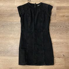 Never Worn. Perfect Condition. Black Fitted Sleeveless Denim Dress, Fitted Black Denim Mini Dress, Fitted Mini Black Denim Dress, Black Short Sleeve Denim Dress For Spring, Black Cotton Edgy Mini Dress, Edgy Black Cotton Mini Dress, Trendy Black Denim Mini Dress, Chic Black Denim Mini Dress, Chic Black Mini Denim Dress