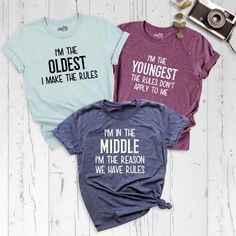 Siblings Shirts, Oldest Middle Youngest Shirts, Big Middle Little Shirt, Matching Siblings Outfits, Sister Birthday Shirt, Sibling Rules Tee Celebrate sibling bonds with our adorable Siblings Shirts and Oldest Middle Shirts or Youngest Shirt collection! Whether you're the Oldest, Middle, or Youngest, our fun and stylish Big Little Shirts are perfect for any occasion. These Matching Siblings Outfits make for great photos, family gatherings, or just everyday fun, while the Sister Birthday Shirt ad Cotton Tops With Funny Text For Birthday, Cotton Top With Funny Text For Birthday, Cotton Birthday Top With Funny Text, Funny Cotton Tops With Custom Text, Birthday Cotton T-shirt With Custom Text, Custom Text Cotton T-shirt For Birthday, Oldest Middle Youngest, Siblings Shirts, Little Sister Shirts